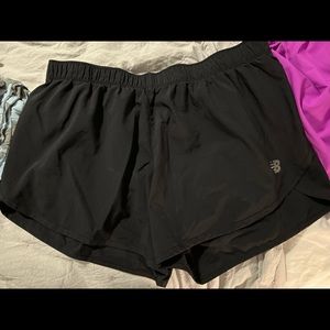 Black New Balance running shorts.